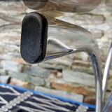 Oval table in smoked glass and metal foot