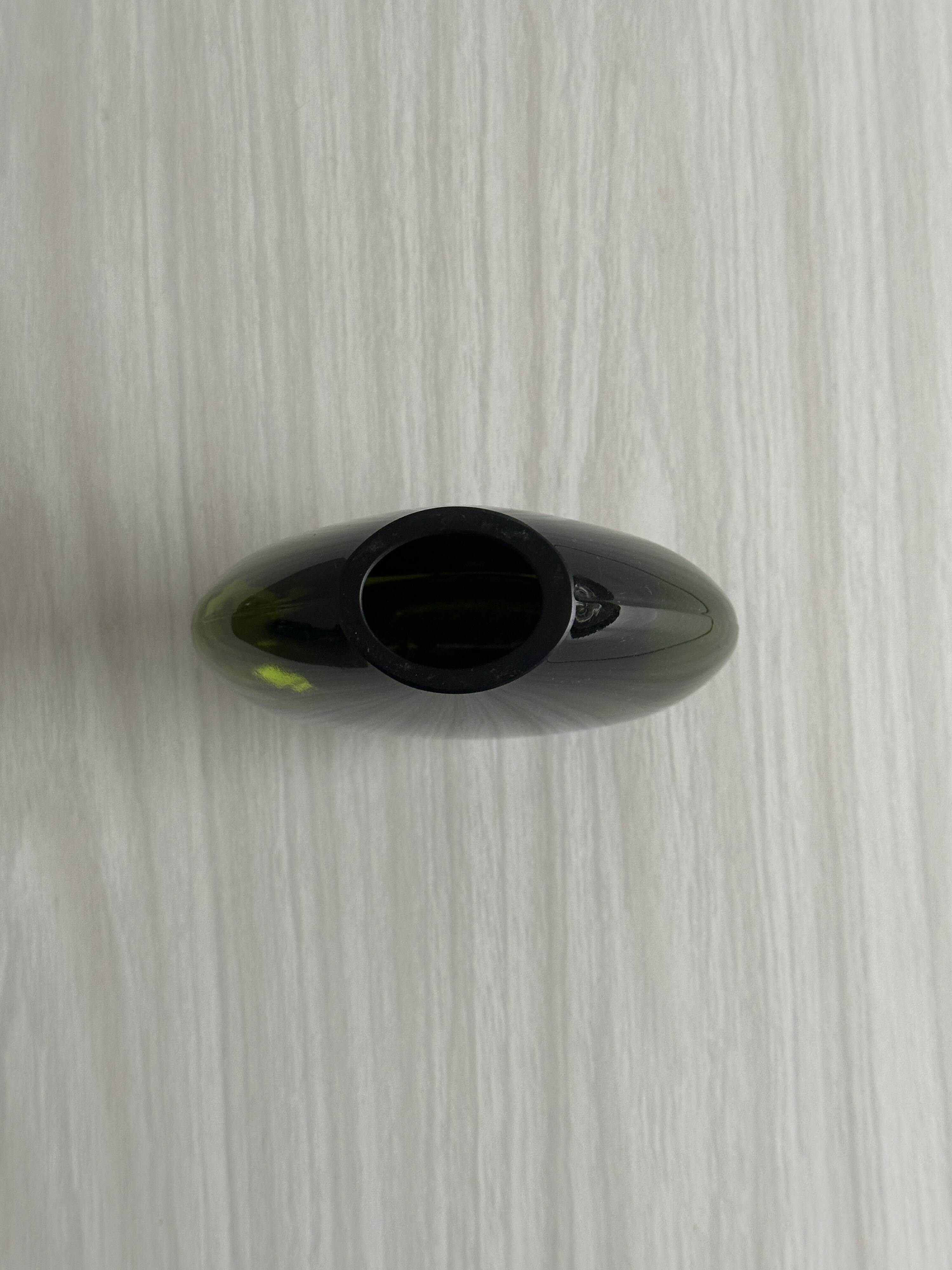 Blown green glass vase