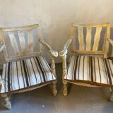 A pair of low armchairs