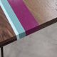 Solid oak coffee table with colored bands on pin legs