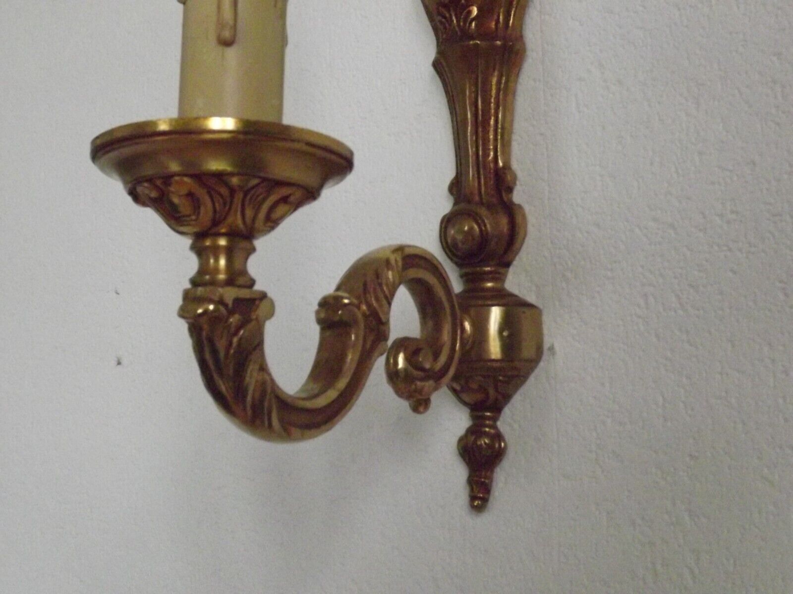 Simple wall sconce in classic Empire style in vintage French bronze.