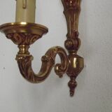 Simple wall sconce in classic Empire style in vintage French bronze.
