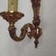 Simple wall sconce in classic Empire style in vintage French bronze.