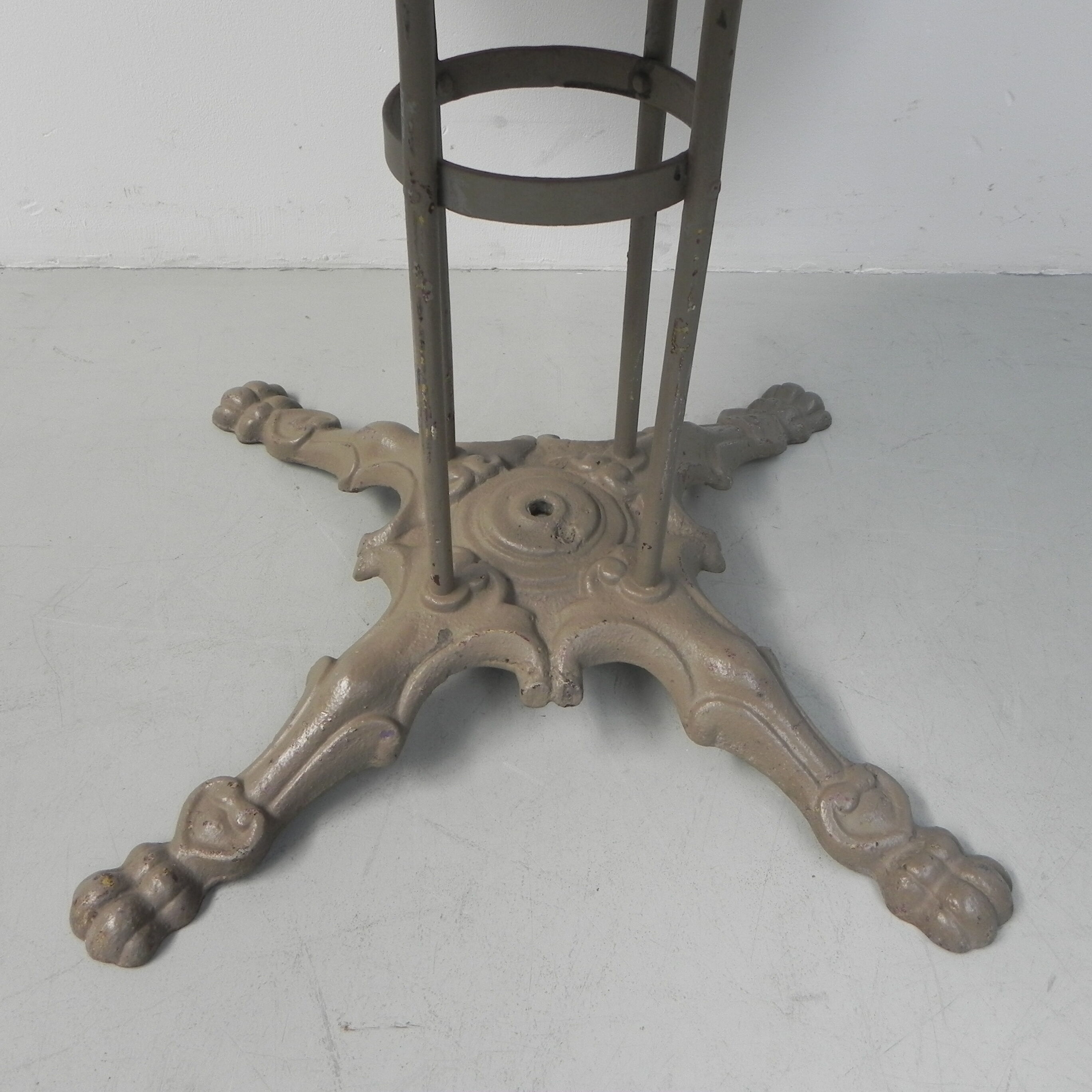 Steel garden table on cast iron base