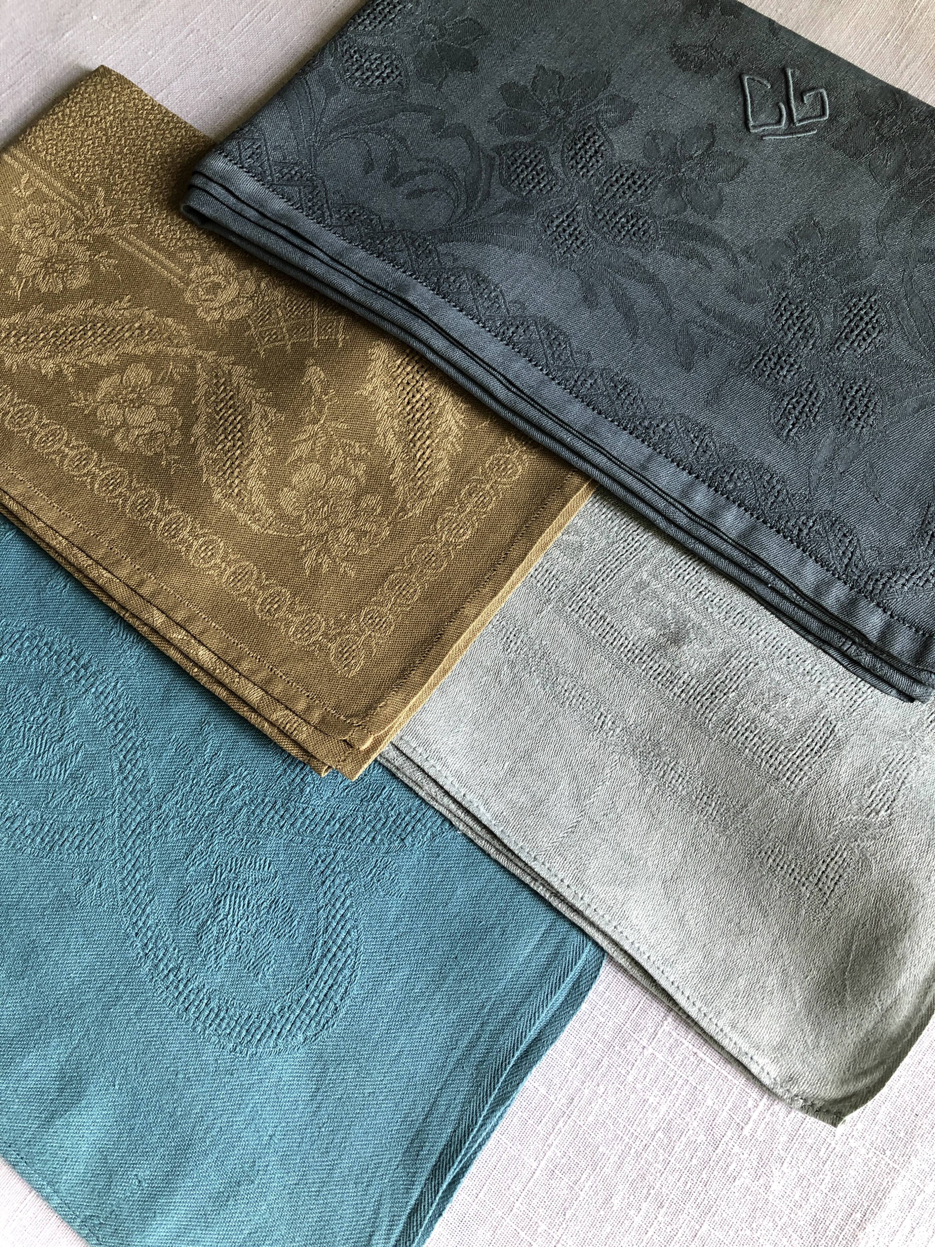 Suite of four tinted antique napkins