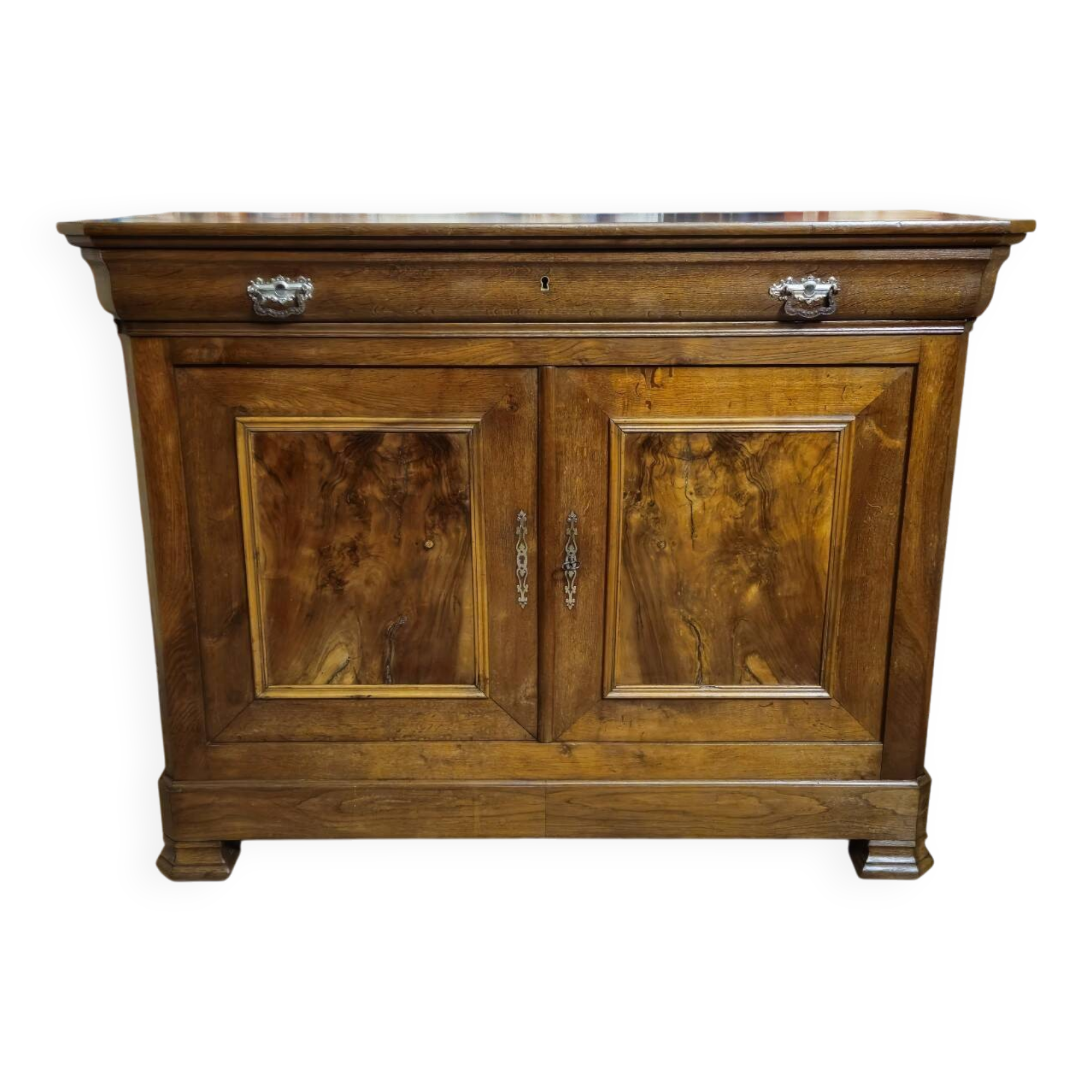 Low buffet with a curved front from the Louis Philippe period in walnut.