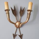 Vintage wall lamp decorated with bronze arrows
