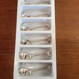 Six silver metal knife holders basset hound