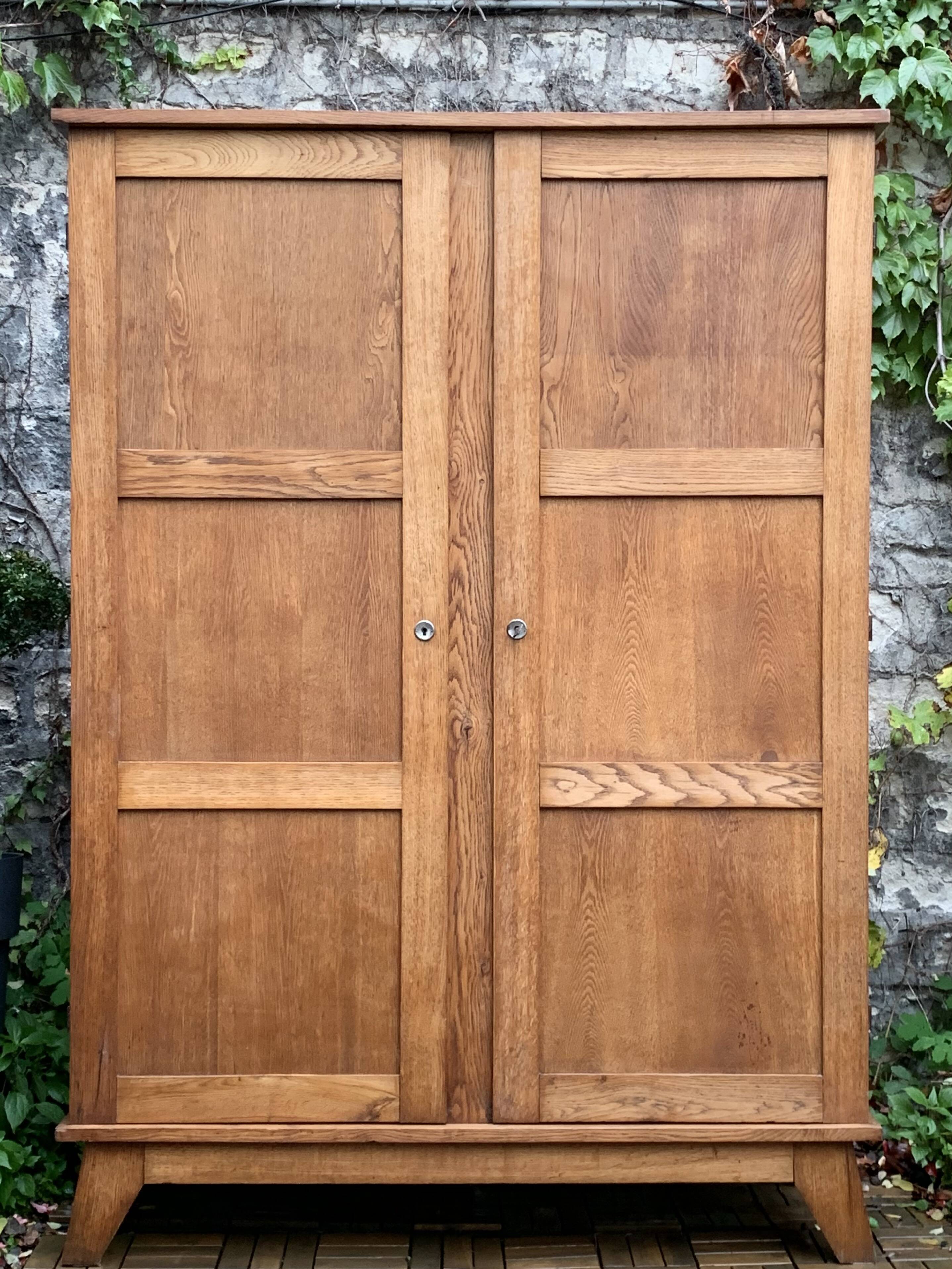 Solid oak compass foot cabinet René Gabriel 1945