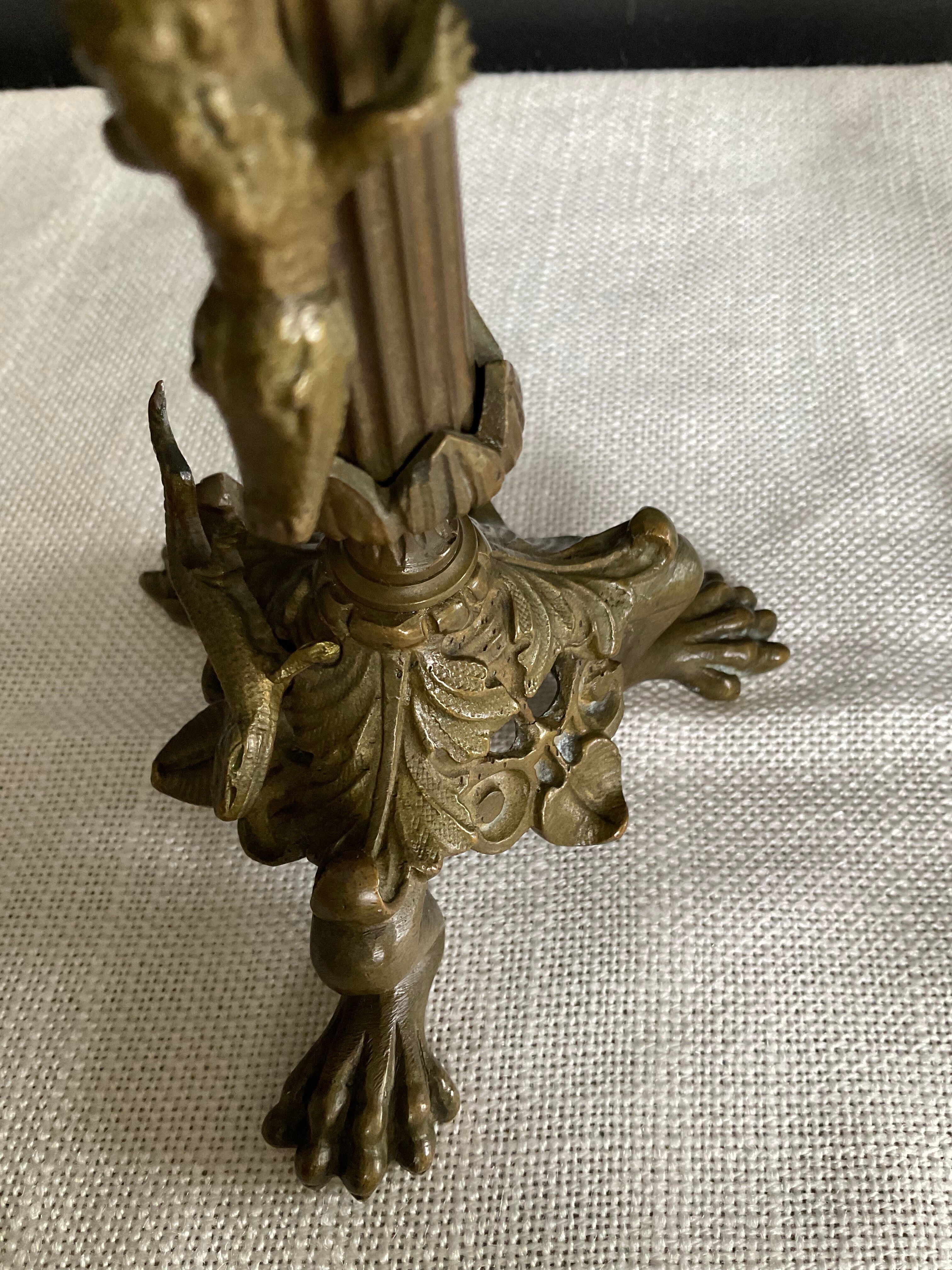 Pair of 19th-century gilded bronze candlesticks in Empire style.