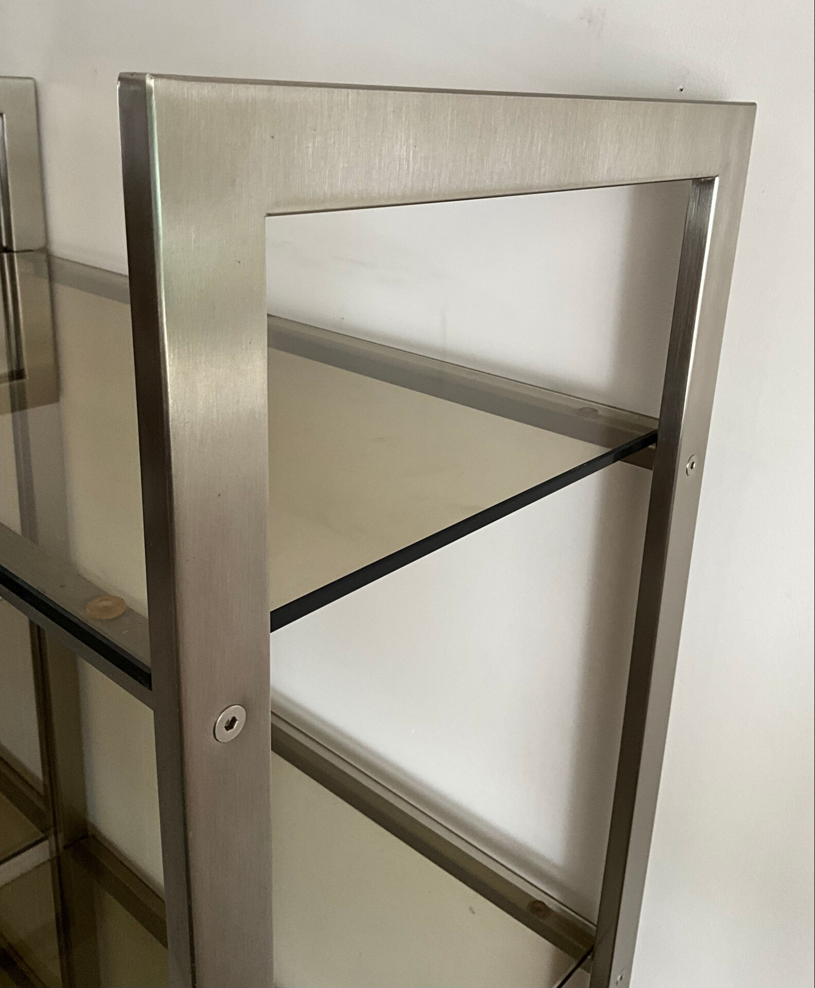 Pair of Artelano bookshelves in anodised metal and smoked glass, 1970s.