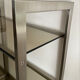 Pair of Artelano bookshelves in anodised metal and smoked glass, 1970s.