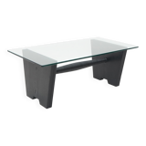 Coffee table with a glass top and black stained wood frame, 1930s.