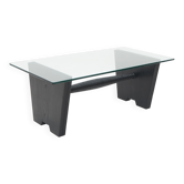 Coffee table with a glass top and black stained wood frame, 1930s.