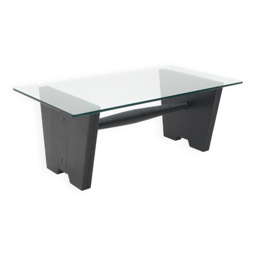 Table basse avec plateau en verre et structure en bois teinté noir, années 1930