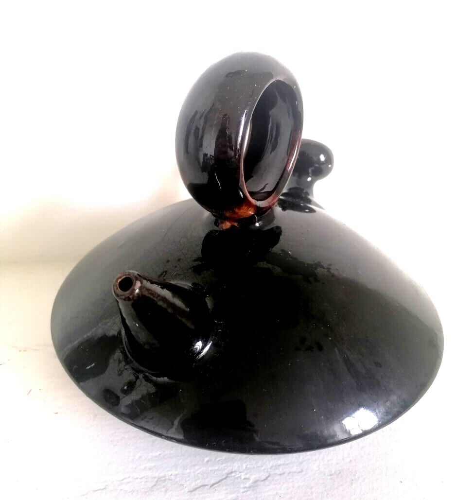 Chevrette modernist in black enamelled sandstone, circa 1970