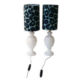 Pair of bedside lamps in alabaster with blue leopard lampshades.