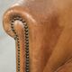 Vintage sheepskin club armchair finished with decorative nails