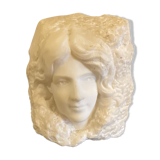 Sculpture woman face in marble block 1900