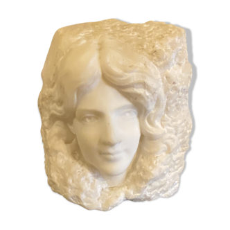 Sculpture woman face in marble block 1900
