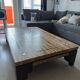 Coffee table in travertine with mother-of-pearl inlays.