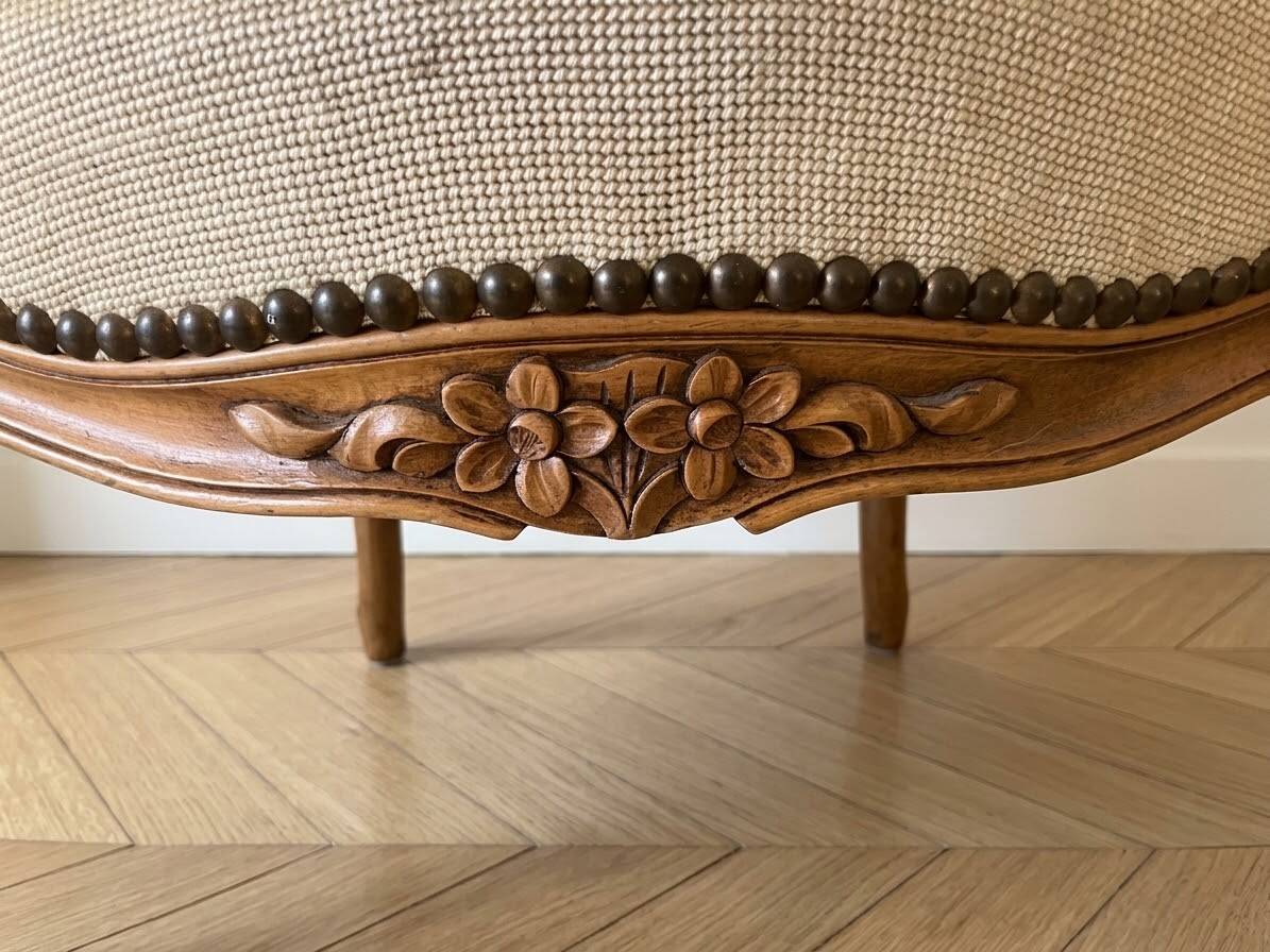Pair of Louis XV/XVI armchairs in carved wood and floral fabric.