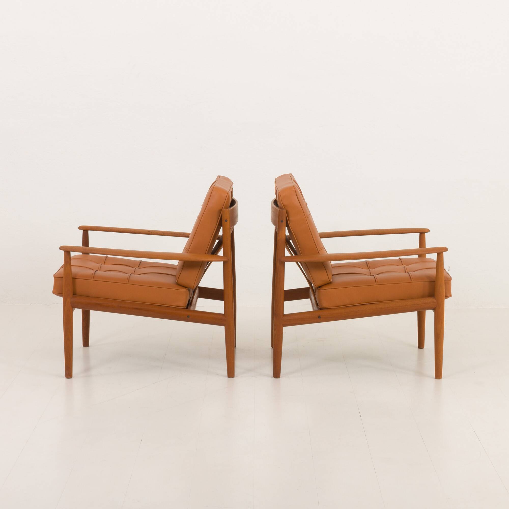 Rare Grete Jalk teak lounge chairs in aniline cognac leather for Cado