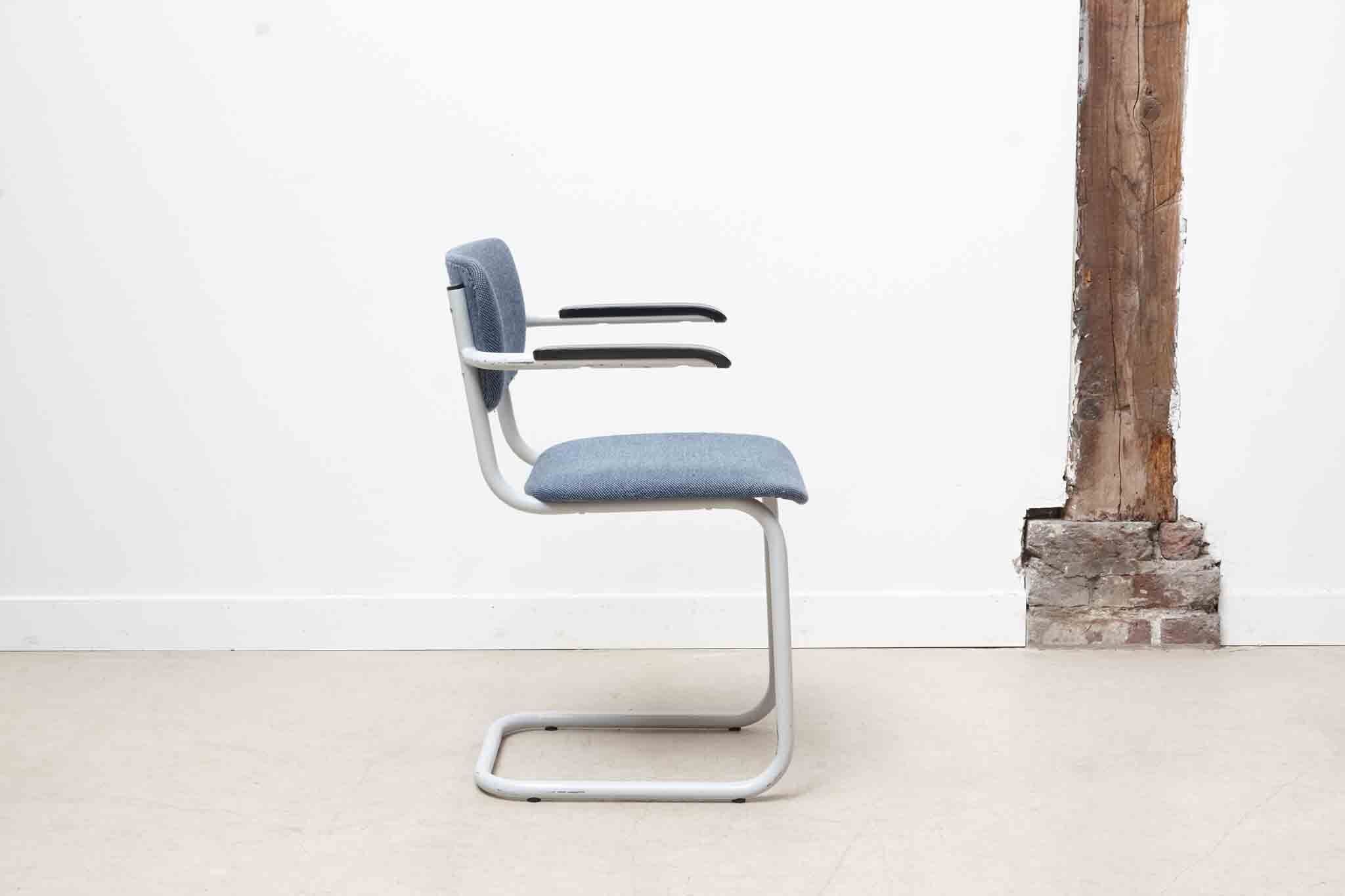 Blue fabric S-shaped chair with armrests
