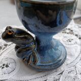 Enamelled pottery eggcup with frog