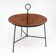 Curved table, wicker and black lacquered brass magazine rack, 1960.