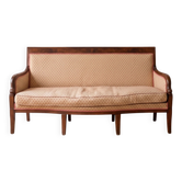 Restoration Empire period canapé bench in carved mahogany.