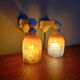 Pair of Art Deco wall sconces in multicoloured porcelain and frosted glass.
