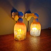 Pair of Art Deco wall sconces in multicoloured porcelain and frosted glass.