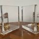 Vintage pair of bookends in lucite and brass from the 1970s.