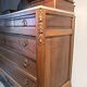 Antique carved wooden dressing table with marble and tilting oval mirror.