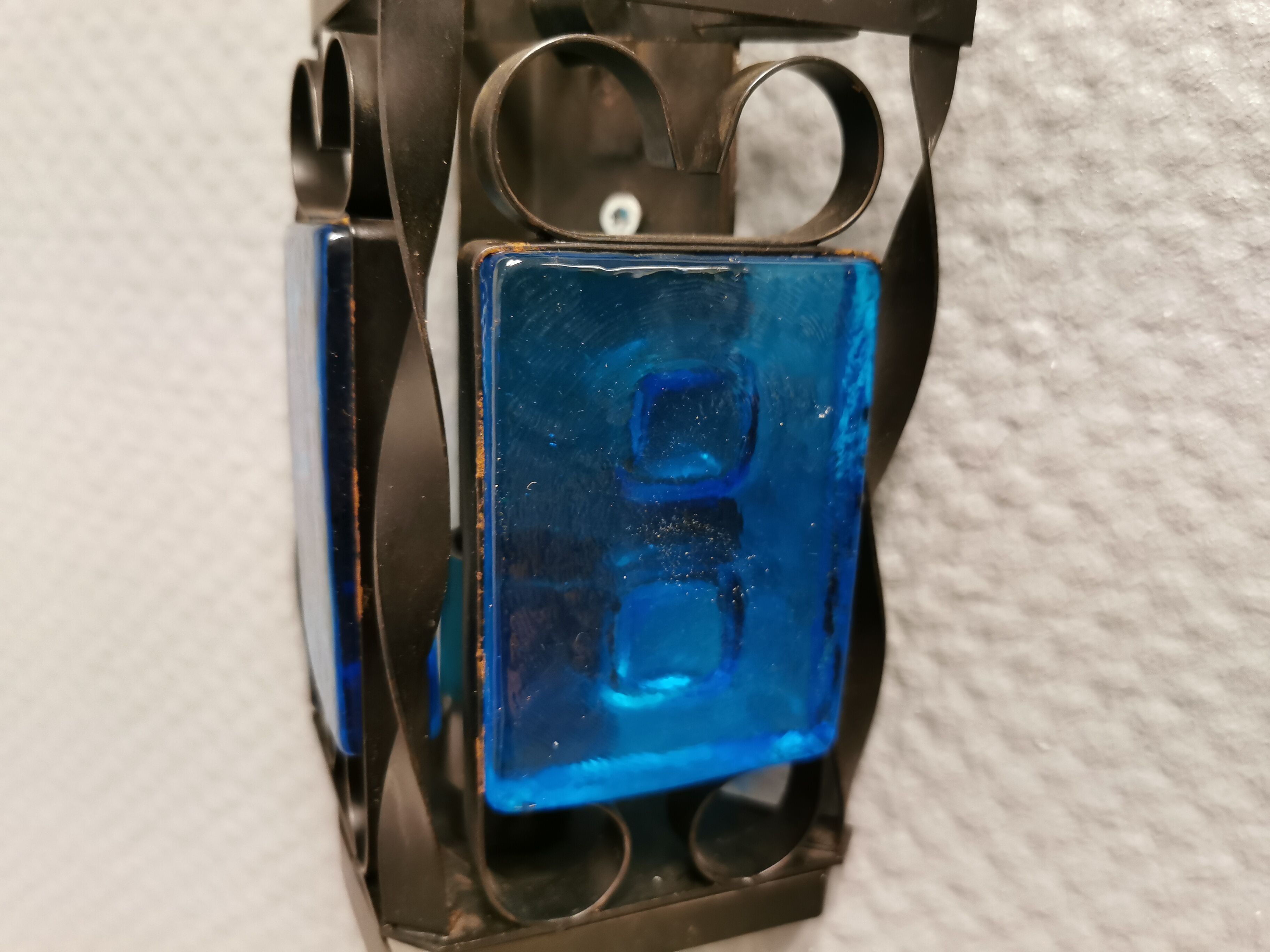 Wall lamps made of black cast iron and handmade thick pressed blue glass
