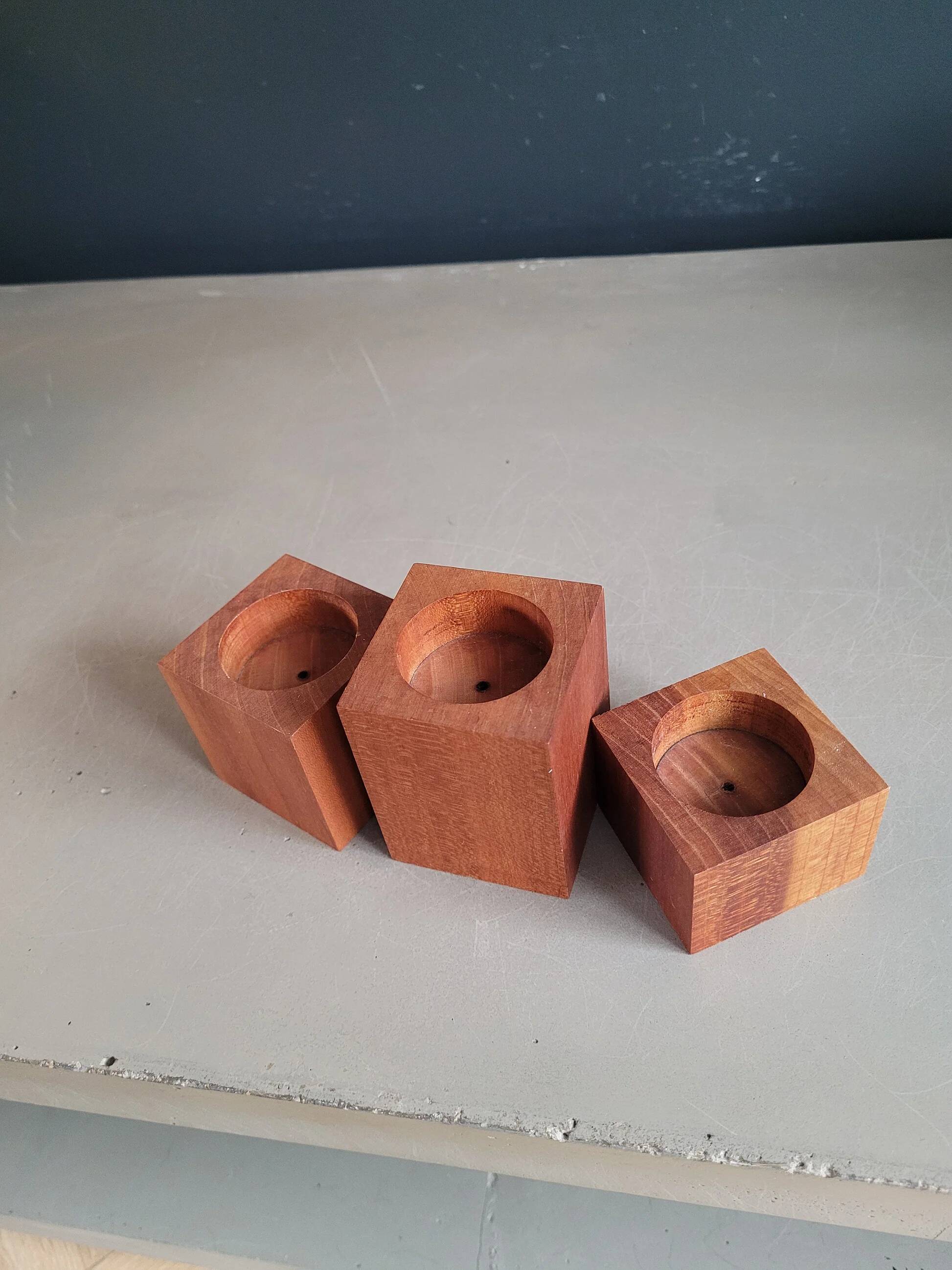 Vintage teak candlestick trio