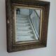 Antique mirror in wood and gilded stucco