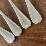 4 teaspoons in silver metal