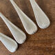 4 teaspoons in silver metal
