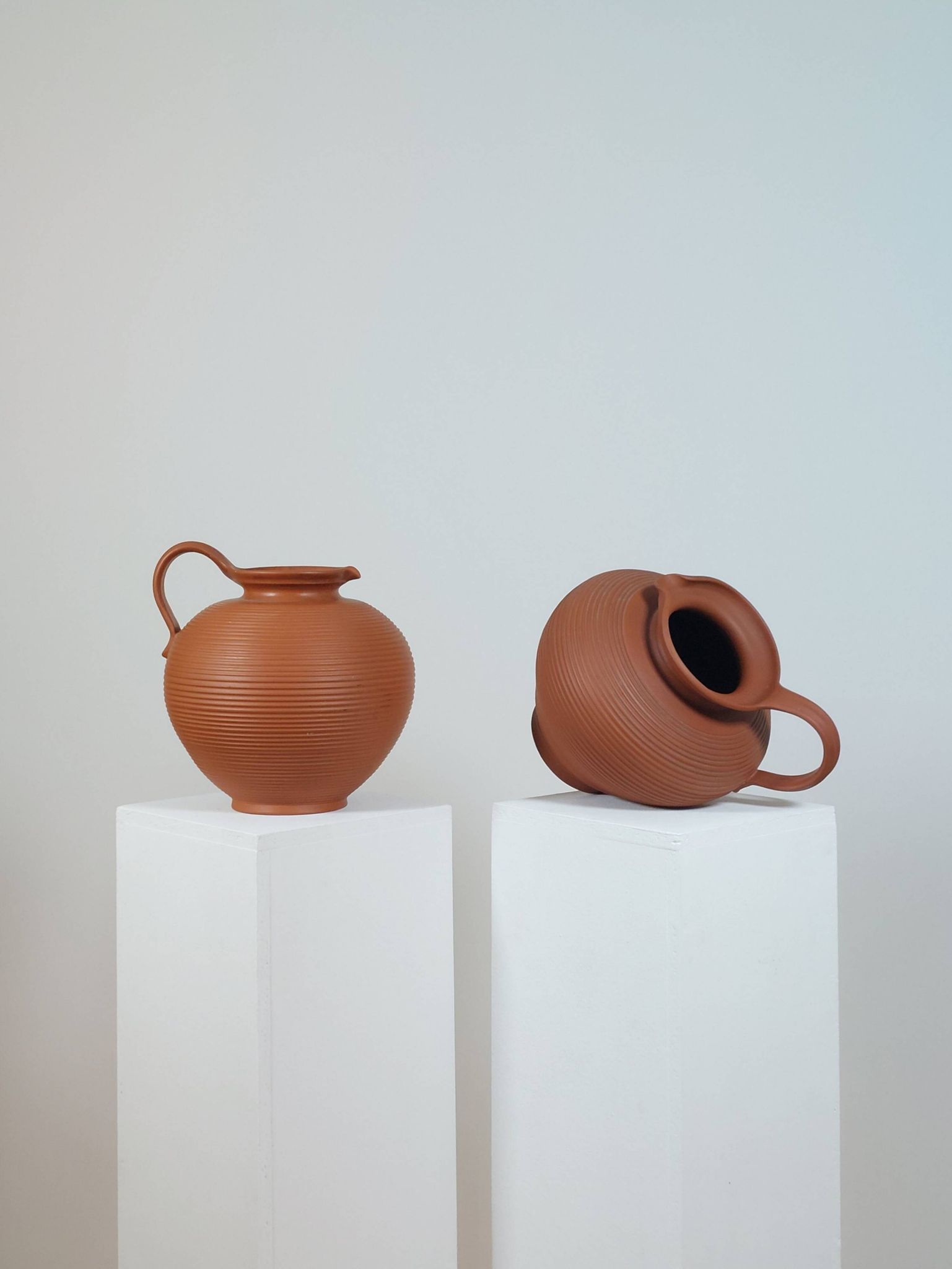 Pair of handcrafted terracotta vases from the mid-century.