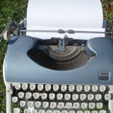 Typewriter blue japy script  with manual and carrying case