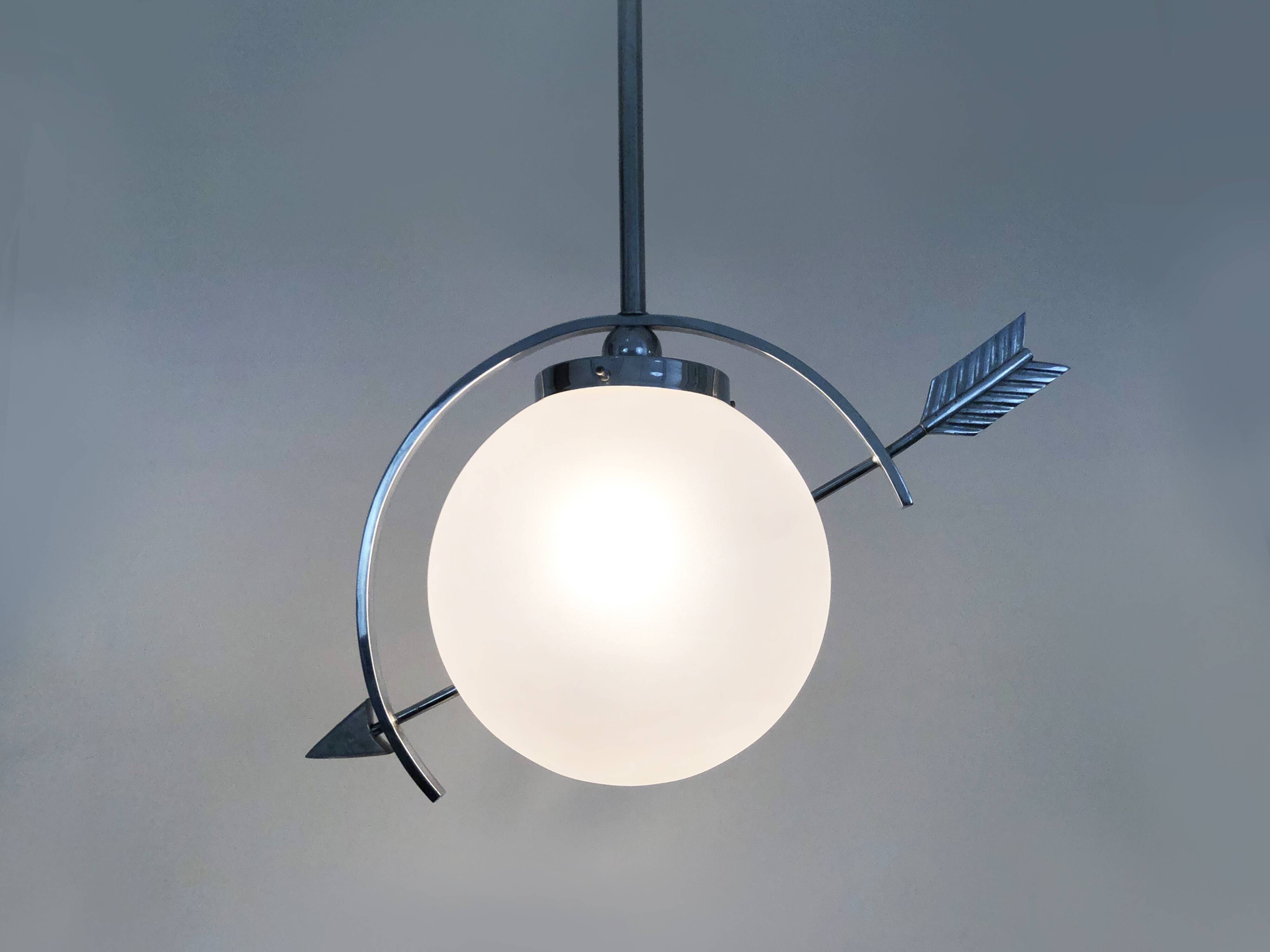 Suspension in chromed metal and glass, space age, arrow crossing a globe. Seventies