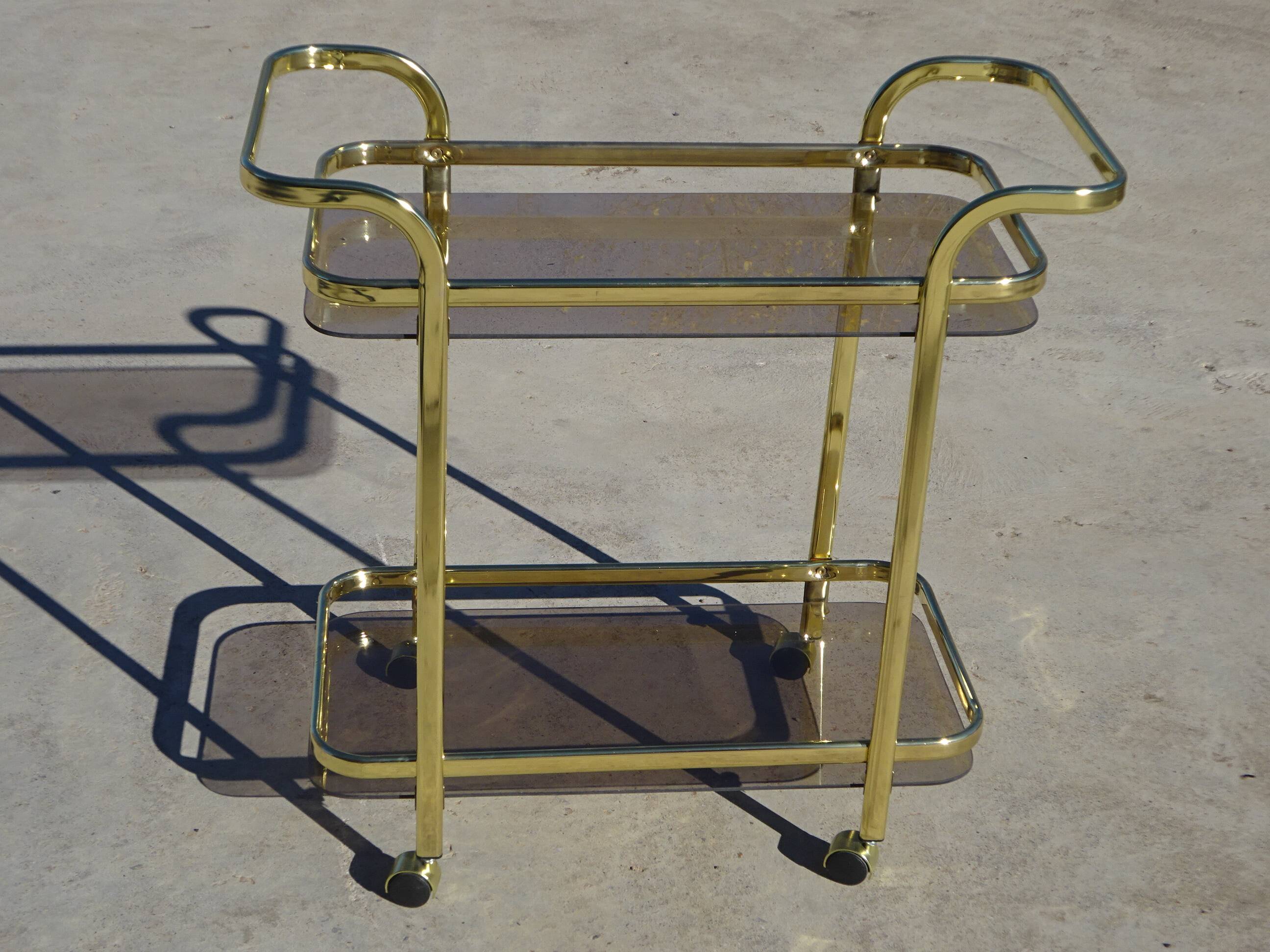 Golden metal and smoked glass dessert table