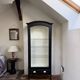 Antique display cabinet repainted in black.