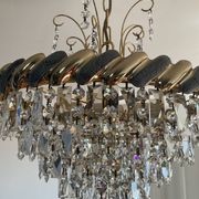 Crystal and brass chandelier with a cascade of pendants.