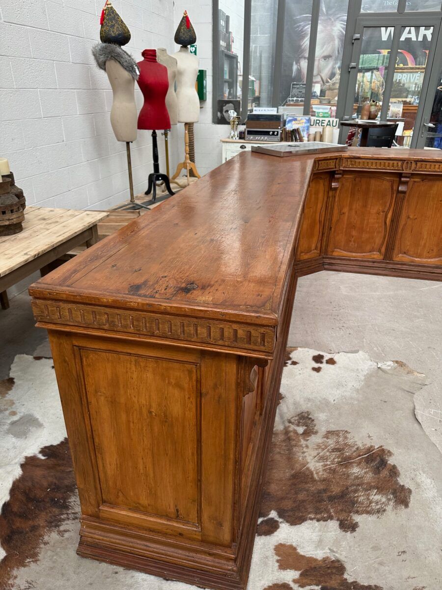 Large corner bar counter from the late 19th century.