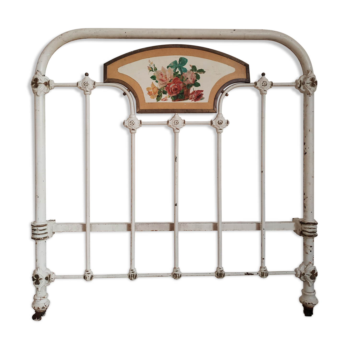 Cast-iron headboard and patinated white wood