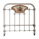 Cast-iron headboard and patinated white wood