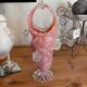 Pink opaline vase with added fruits
